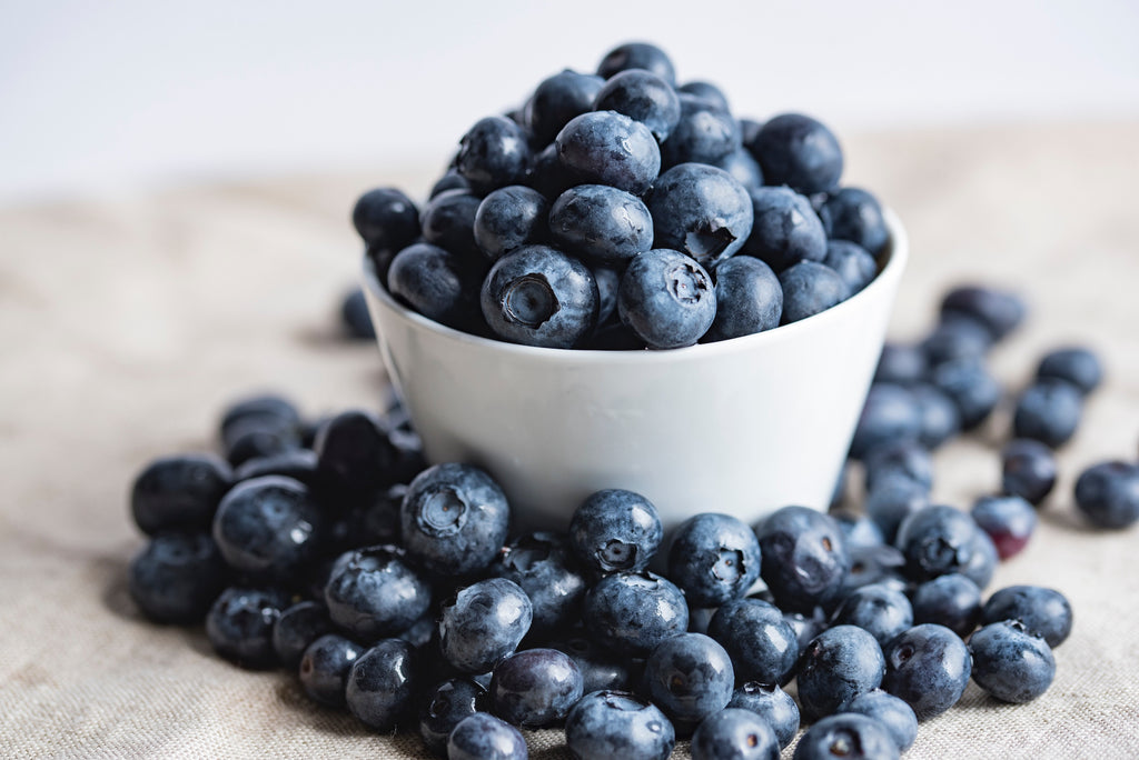 a bowl of blueberries, which contain antioxidants that reduce joint pain